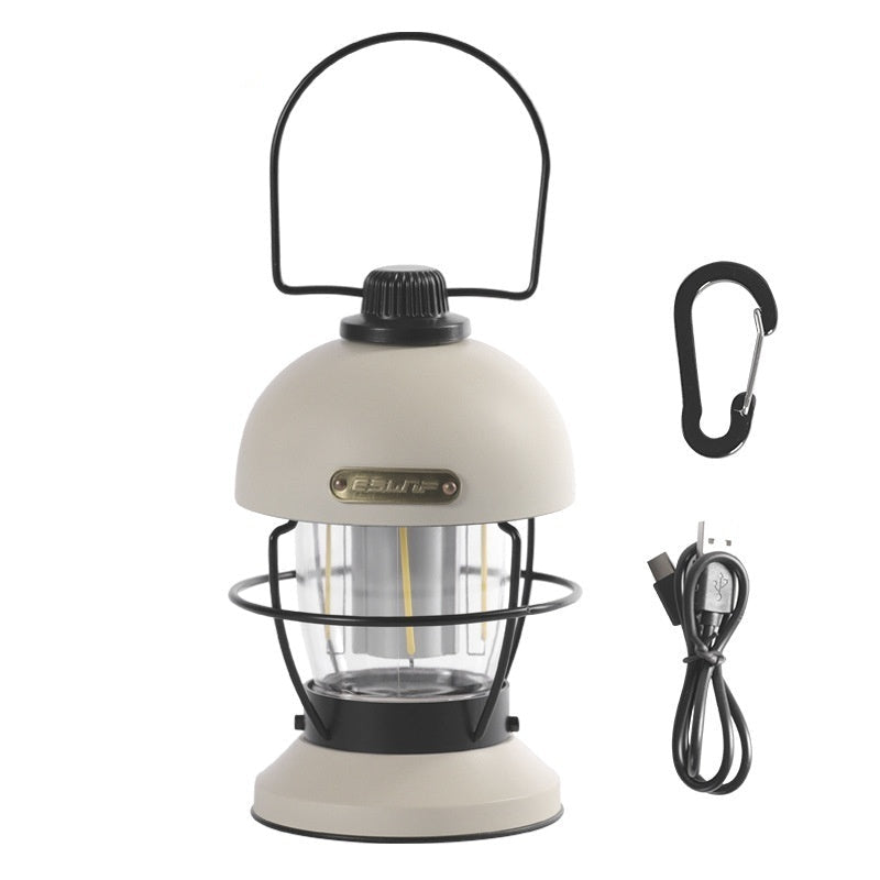 Nivesia rechargeable LED camping lantern glowing at a campsite