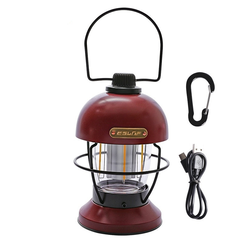 Nivesia rechargeable LED camping lantern glowing at a campsite